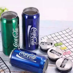 Three Coca-Cola branded stainless steel tumblers in green and blue with matching lids.