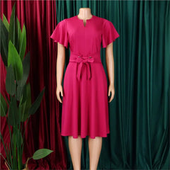 A magenta knee-length midi dress with short flutter sleeves, a V-neckline, and a tie-waist belt.
