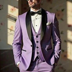 A man wears a three-piece lavender suit with a black shawl collar, vest, and bow tie.