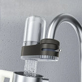 A faucet-mounted water purifier with a clear filter housing and a switch for water flow control.