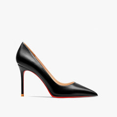 A black pointed-toe pump with a thin high heel and a signature red sole.