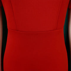 A close-up view of the waist and bodice of a solid red sheath dress with short sleeves.