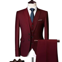 A three-piece burgundy suit set for men featuring a slim-fit jacket, vest, and matching trousers.