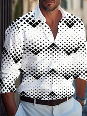 A man wears a long-sleeved white button-down shirt featuring a black geometric diamond pattern.