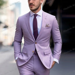 A man wears a light purple two-piece suit with a white shirt and a dark purple tie.