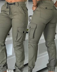 Olive green slim-fit cargo pants with multiple pockets, a drawstring waist, and cuffed ankles.