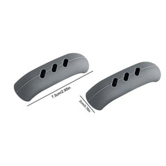 Two grey silicone handle covers with three oval cutouts each, measuring 7.5cm by 2cm.