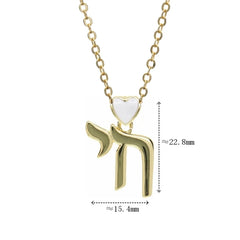 A gold-toned Hebrew Chai pendant necklace featuring a small white heart accent.