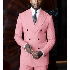 A man wears a pink pinstriped double-breasted suit with a peak lapel and a dark polka dot tie.