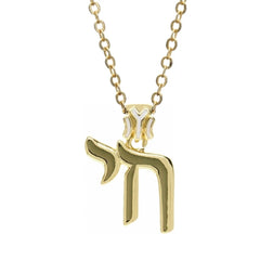 A gold-toned copper pendant necklace featuring the Hebrew letter Chai on a delicate chain.