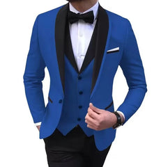 A man wears a slim-fit royal blue three-piece suit with a black shawl lapel and a bow tie.