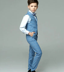 A boy wears a light blue plaid four-piece formal suit with a vest, shirt, pants, and bowtie.