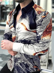 A man wears a slim-fit, long-sleeved shirt featuring a black, white, and orange marble print.