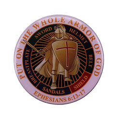 A round metal lapel pin featuring a knight with a shield and the Armor of God text.