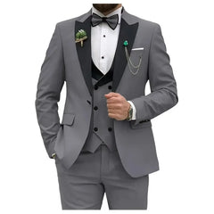 A slim-fit grey three-piece suit featuring a black lapel, vest, and bowtie.