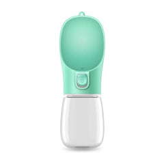 A mint green portable pet water bottle with a clear plastic reservoir and a paw-print button.