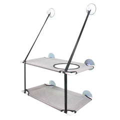 A two-tier cat hammock with mesh beds and suction cups for window mounting.