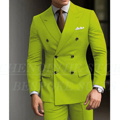 A man wears a lime green double-breasted slim fit suit with a brown tie and white pocket square.