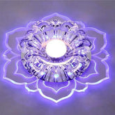 A modern crystal ceiling light shaped like a flower with a glowing purple acrylic base.