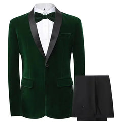 A dark green velvet tuxedo blazer with a black shawl lapel paired with matching black trousers.