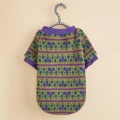 A green and purple patterned pet sweater with a ribbed collar and short sleeves.