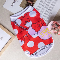 A red and white polka-dot dog tank top featuring a Minnie Mouse-inspired bow design.