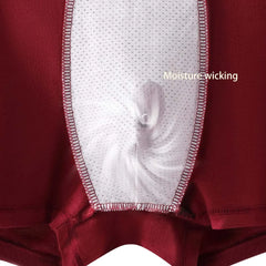 A close-up of red men's boxer shorts featuring a white breathable mesh panel in the center.