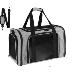 A grey, soft-sided pet carrier with black mesh windows and an included shoulder strap.