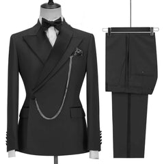 A black double-breasted men's suit with a peak lapel, pocket chain, and matching trousers.
