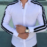 A white long-sleeve button-up shirt for men featuring black stripes along the shoulders and arms.