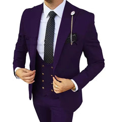 A man wears a slim-fit purple three-piece suit with a polka-dot tie and a lapel chain.