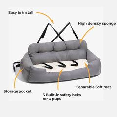 A grey, rectangular dog car seat with a soft white mat, three safety belts, and storage pockets.
