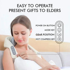 A woman wears a beige neck and shoulder massager with a control panel showing four buttons.