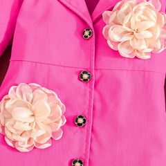 A bright pink long-sleeve blazer dress for girls featuring large 3D floral appliques and buttons.