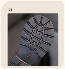 The black rubber outsole of a child's boot features a deep tread pattern and a size 28 label.