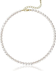 A dainty choker necklace featuring a strand of small, oval white freshwater pearls.