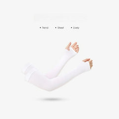 A pair of white cooling arm sleeves with thumb holes worn on a person's arms.
