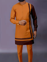 A man wearing a mustard yellow and brown long-sleeved tunic with matching trousers.
