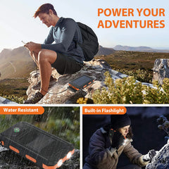 A black portable solar power bank with a built-in flashlight and compass for outdoor use.