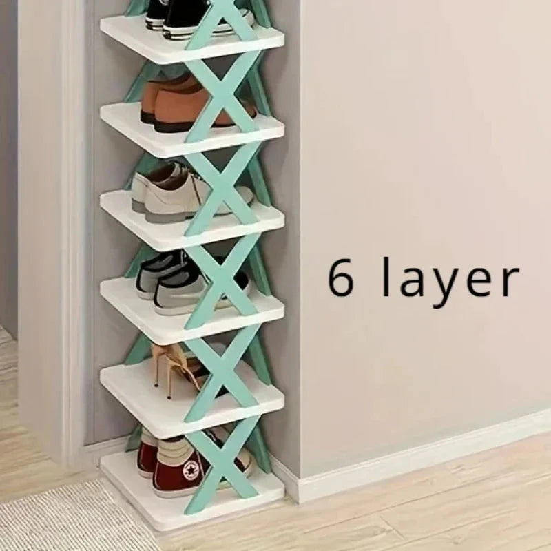 A six-layer vertical shoe rack with white shelves and teal X-shaped supports.