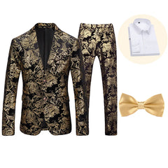 A slim-fit men's suit set featuring a black and gold paisley print jacket, matching trousers, a white dress shirt, and a gold bow tie.