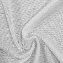 A close-up view of white, lightweight, breathable mesh fabric with a subtle textured pattern.