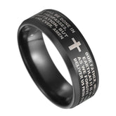 A black stainless steel ring engraved with the Lord's Prayer and a central cross symbol.