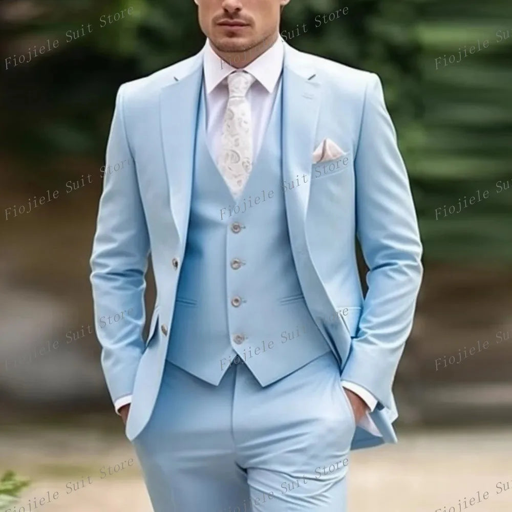 A man wears a light blue three-piece suit consisting of a jacket, vest, and trousers.
