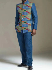 A man wears a blue two-piece suit featuring a patterned African print panel on the jacket front.