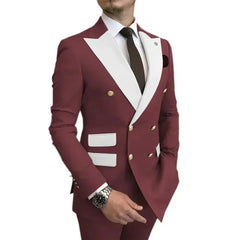 A man wears a burgundy double-breasted blazer with white lapels and matching trousers.