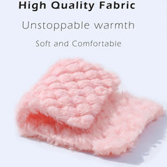 A close-up view of a folded piece of soft, light pink flannel fabric with a textured surface.