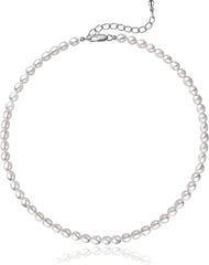 A dainty choker necklace featuring a strand of small, white oval freshwater pearls.