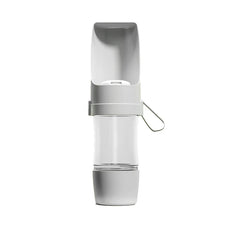 A white portable pet water bottle with a clear central container and a foldable drinking bowl top.
