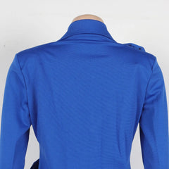 The back view of a slim-fit royal blue blazer with a notched collar on a mannequin.